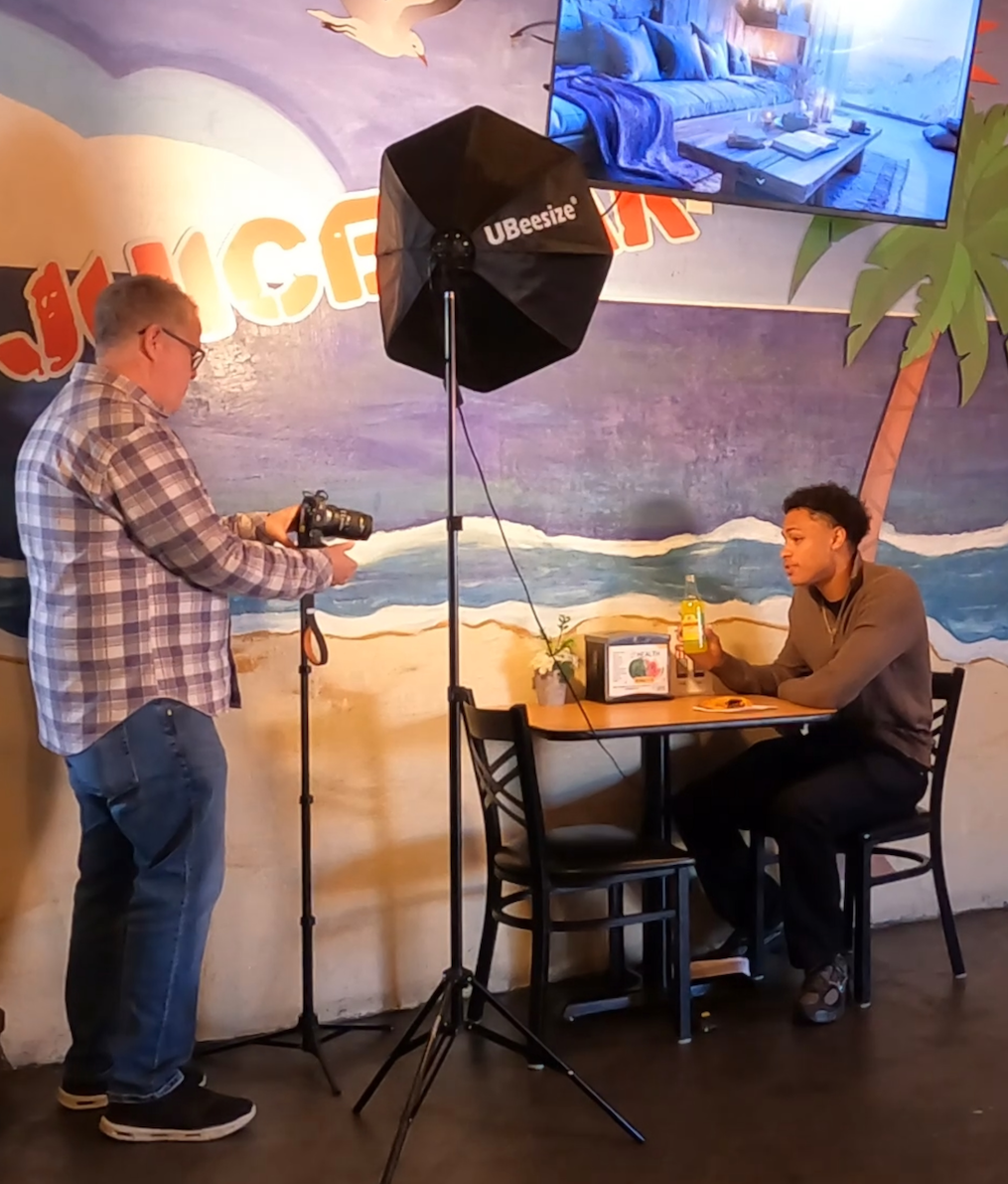 Eric Wein filming a content shoot on location at a restaurant